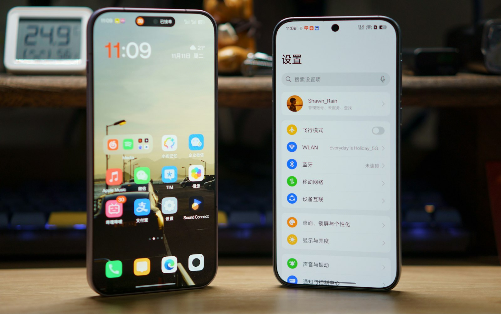 Two smartphones showing app screens on a desk.