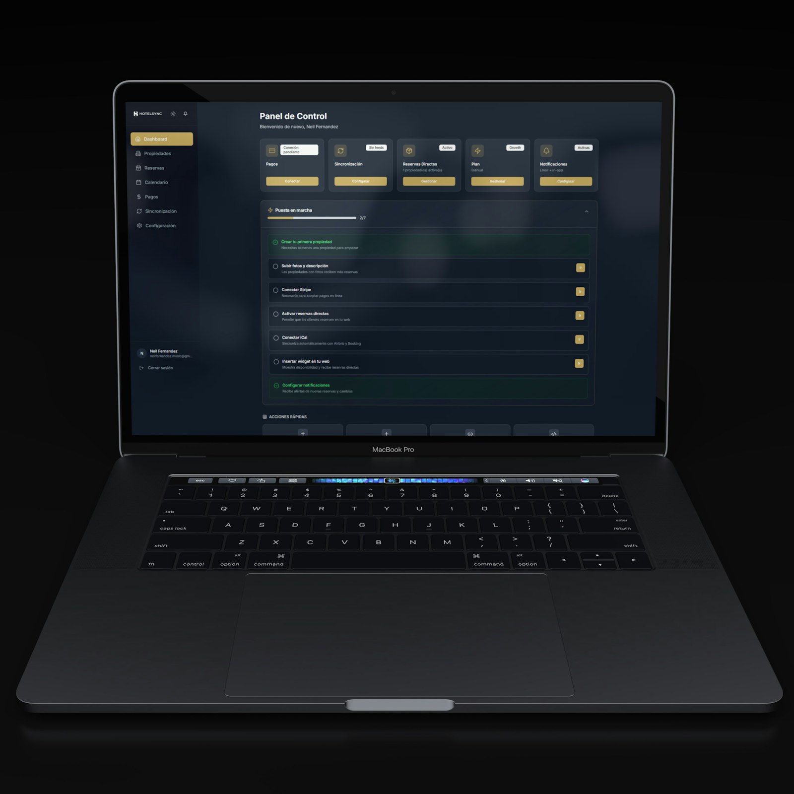 Laptop displaying a dark dashboard interface.